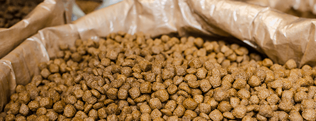 Close up of brown feed pellets in bulk