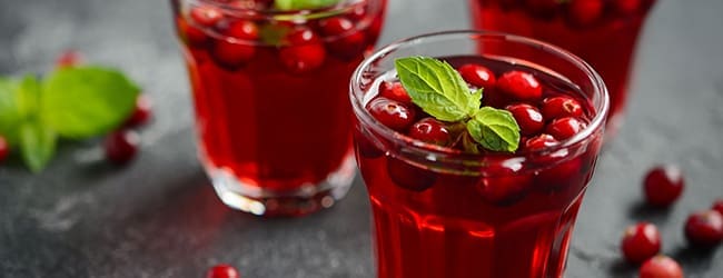 glasses of cranberry juice with fresh cranberries