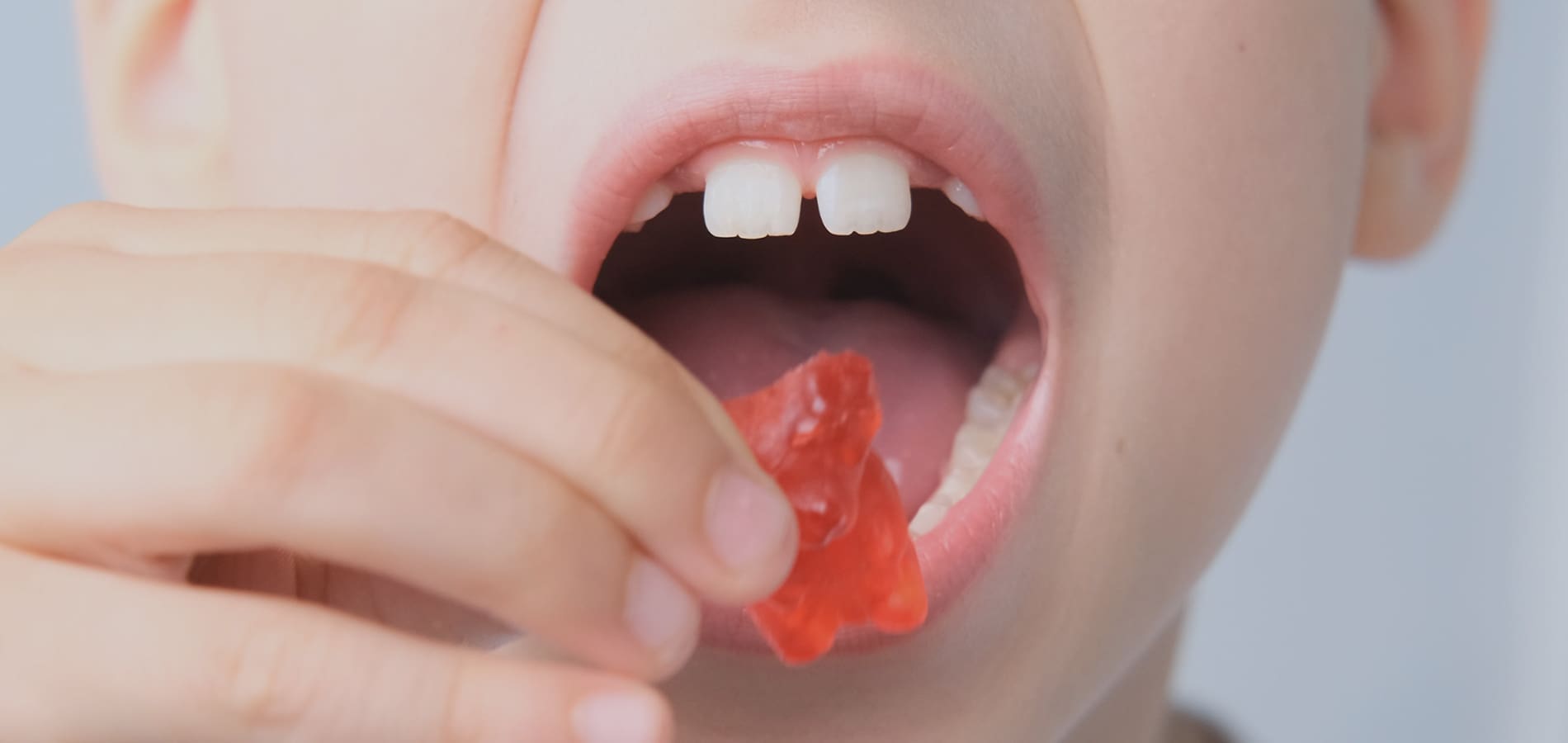 Child eating a gummy bear